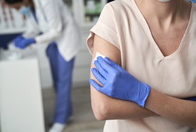 Patient sitting in a doctor's office after vaccination